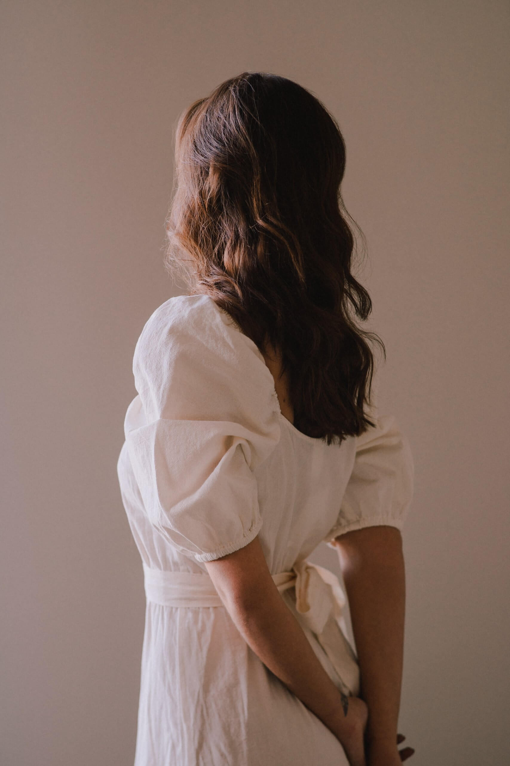 slim girl in white frock barefoot poses against row of palms Stock Photo |  Adobe Stock