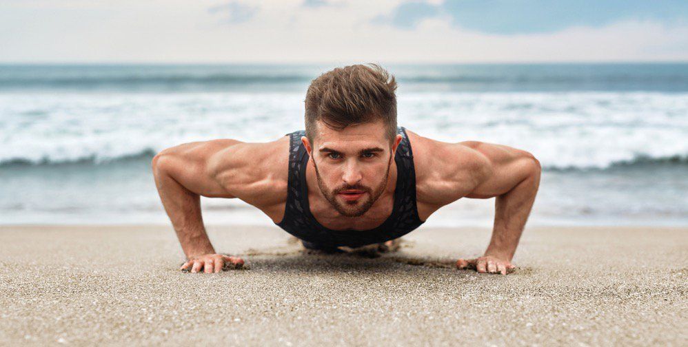 Young male athlete bodybuilder posing and doing sports exercises - Stock  Image - Everypixel