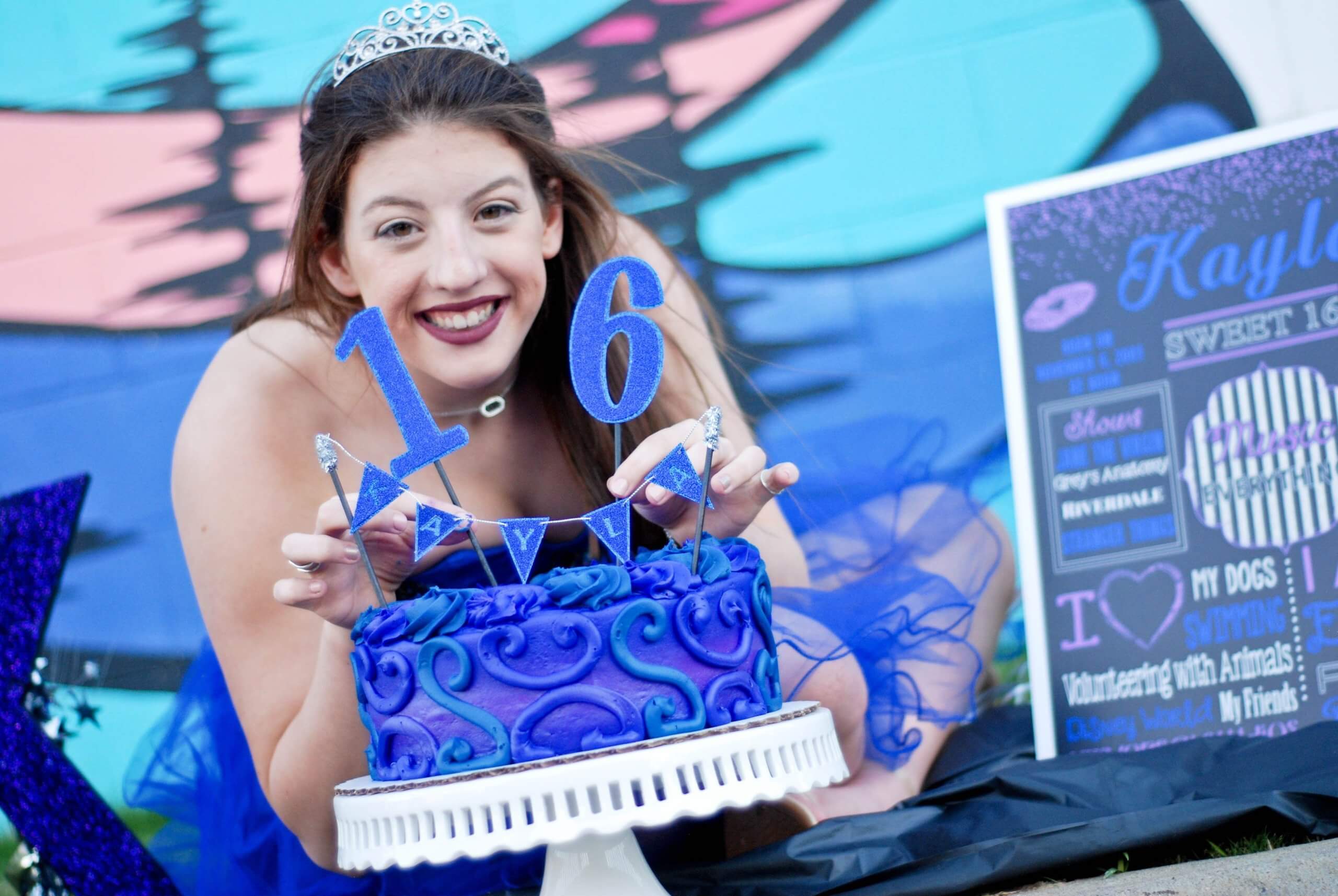 a girl celebrating her birthday in blue theme