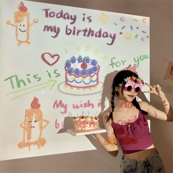 a girl posing with her birthday cake
